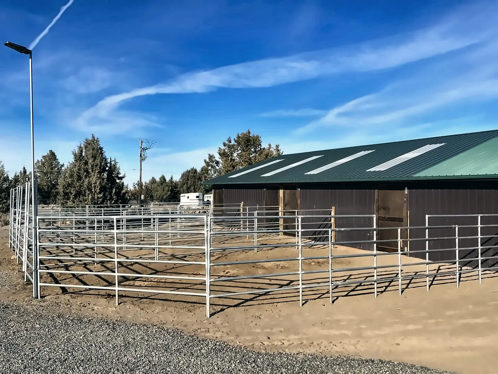 The small barn with overnight stalls and paddocks